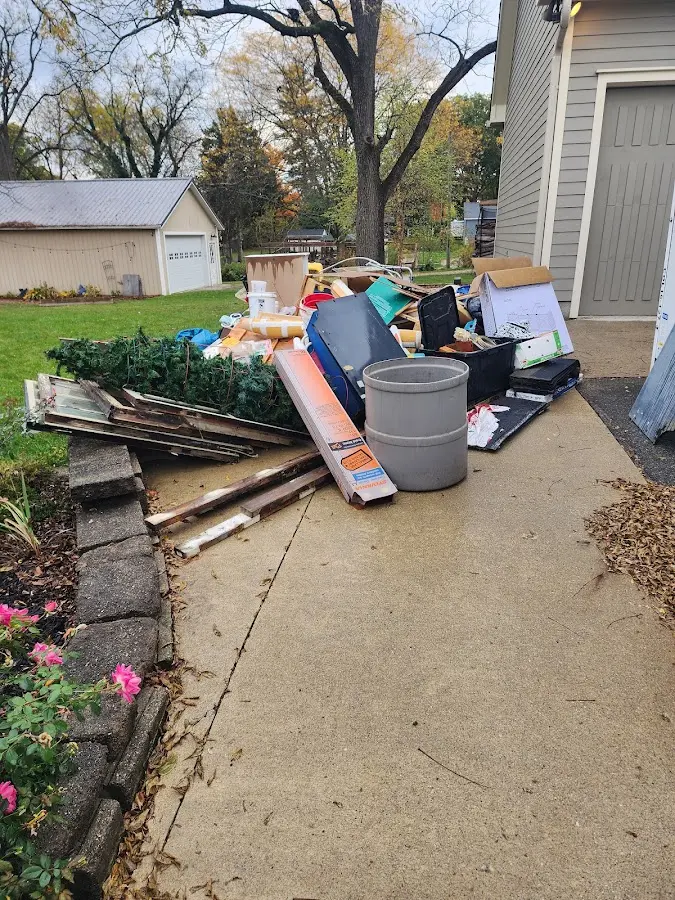 Dumpster being loaded with debris for Residential Dumpster Rental in Pleasanton